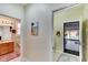 Hallway with access to bathroom and backyard at 242 Shell Falls Dr, Apollo Beach, FL 33572