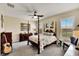 Main bedroom with post bed, ceiling fan and ample closet space at 242 Shell Falls Dr, Apollo Beach, FL 33572