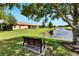 Park bench overlooking the tranquil pond at 242 Shell Falls Dr, Apollo Beach, FL 33572
