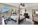 Guest bedroom with a post bed, ceiling fan, and window at 242 Shell Falls Dr, Apollo Beach, FL 33572