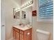 Neat bathroom with a vanity, toilet, and window at 242 Shell Falls Dr, Apollo Beach, FL 33572
