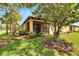 Screened patio with backyard access and lush landscaping at 242 Shell Falls Dr, Apollo Beach, FL 33572