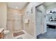 Bathroom with shower and toilet, with view into bedroom at 242 Shell Falls Dr, Apollo Beach, FL 33572