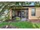 Spacious screened patio featuring a grill and backyard views at 242 Shell Falls Dr, Apollo Beach, FL 33572