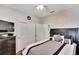 Spacious bedroom with a queen bed, closet, and TV at 242 Shell Falls Dr, Apollo Beach, FL 33572