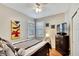 Bright bedroom with a comfortable bed, dresser, and large window at 242 Shell Falls Dr, Apollo Beach, FL 33572