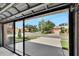 Garage with screen door and neighborhood view at 242 Shell Falls Dr, Apollo Beach, FL 33572