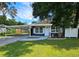 Charming one-story home with carport and landscaped lawn at 10007 N 22Nd St, Tampa, FL 33612