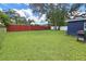 Large backyard with a privacy fence and plenty of space for outdoor activities at 10007 N 22Nd St, Tampa, FL 33612