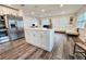 Kitchen island with white shaker cabinets and a quartz countertop at 10007 N 22Nd St, Tampa, FL 33612