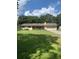 Ranch style home with mature landscaping and a spacious yard at 2705 Ranch Rd, Dover, FL 33527