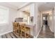 Kitchen boasts a breakfast bar, granite counters, and light wood cabinets at 241 Skiff Pt # 4, Clearwater Beach, FL 33767