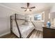 Bedroom with full-size bed and bunk bed, hardwood floors at 241 Skiff Pt # 4, Clearwater Beach, FL 33767