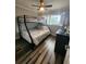 Bedroom with a full-size bed and a bunk bed at 241 Skiff Pt # 4, Clearwater Beach, FL 33767