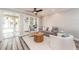 Cozy living room with a sofa and access to a patio at 241 Skiff Pt # 4, Clearwater Beach, FL 33767
