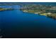 Aerial view of waterfront homes and lush landscape at 656 Spring Lake W Cir, Tarpon Springs, FL 34688