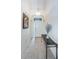 Bright entryway with tile floors and a console table at 656 Spring Lake W Cir, Tarpon Springs, FL 34688