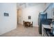 Eat-in kitchen with breakfast table and view of hallway at 656 Spring Lake W Cir, Tarpon Springs, FL 34688