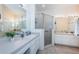 Large bathroom with double vanity, shower, and ample counter space at 656 Spring Lake W Cir, Tarpon Springs, FL 34688