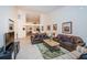 Spacious living room with leather sofas and high ceilings at 656 Spring Lake W Cir, Tarpon Springs, FL 34688