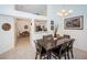 Formal dining room with dark wood table and view of kitchen at 656 Spring Lake W Cir, Tarpon Springs, FL 34688