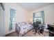 Charming bedroom with daybed, workspace, and natural light at 656 Spring Lake W Cir, Tarpon Springs, FL 34688