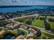 Bird's-eye view of community near lake and golf course at 656 Spring Lake W Cir, Tarpon Springs, FL 34688