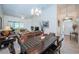 Living room with leather sofas and view of dining area at 656 Spring Lake W Cir, Tarpon Springs, FL 34688