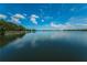 Scenic view of a tranquil lake with clear blue water at 656 Spring Lake W Cir, Tarpon Springs, FL 34688