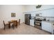 Kitchen with stainless steel appliances and breakfast nook at 656 Spring Lake W Cir, Tarpon Springs, FL 34688