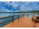 Relax and enjoy the view from this spacious lakefront dock with seating at 656 Spring Lake W Cir, Tarpon Springs, FL 34688