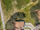 Aerial view of property showing house, yard, and surrounding area at 656 Spring Lake W Cir, Tarpon Springs, FL 34688