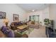 Living room with ample natural light and comfortable seating at 656 Spring Lake W Cir, Tarpon Springs, FL 34688