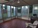 Bright sunroom featuring tiled floors and backyard access at 3317 W Louisiana Ave, Tampa, FL 33614