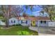 Charming house with a yellow door and well-maintained lawn at 4317 S Hale Ave, Tampa, FL 33611