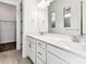 Bathroom featuring a double vanity with white quartz countertop, and tile floors at 13720 Brookside Haven St, Riverview, FL 33578