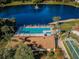 Community pool, shuffleboard, and clubhouse aerial view at 2688 Pine Ridge N Way # A2, Palm Harbor, FL 34684