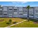 Exterior view of the building, landscaping and walkway at 1868 Shore S Dr # 207, South Pasadena, FL 33707