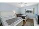 Bedroom with two twin beds, a TV and ceiling fan at 1868 Shore S Dr # 207, South Pasadena, FL 33707