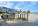 Private dock with colorful chairs and water access at 1868 Shore S Dr # 207, South Pasadena, FL 33707