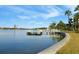Community dock with seating, offering waterfront access at 1868 Shore S Dr # 207, South Pasadena, FL 33707