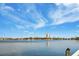 Scenic waterfront view with boats and buildings in the distance at 1868 Shore S Dr # 207, South Pasadena, FL 33707