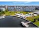 Aerial view of the community, pool, and waterway at 1868 Shore S Dr # 207, South Pasadena, FL 33707