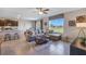 Open concept living space with kitchen, living room, and dining area at 3092 Living Coral St, Wimauma, FL 33598