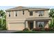 Two-story home with neutral siding, large garage, and landscaping at 3092 Living Coral St, Wimauma, FL 33598