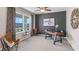 Spacious home office with large window, comfortable seating, and a workspace at 3092 Living Coral St, Wimauma, FL 33598