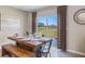 Farmhouse dining area with sliding doors leading to the backyard at 3092 Living Coral St, Wimauma, FL 33598