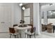 Breakfast nook with round table and chairs, adjacent to sliding glass doors at 13720 Brookside Haven St, Riverview, FL 33578