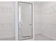 Bright walk-in closet with ample shelving and a full-length mirror at 13720 Brookside Haven St, Riverview, FL 33578