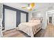 Comfortable bedroom with a decorative accent wall, a light wood floor and ample closet space at 214 Cape Harbour Loop # 105, Bradenton, FL 34212